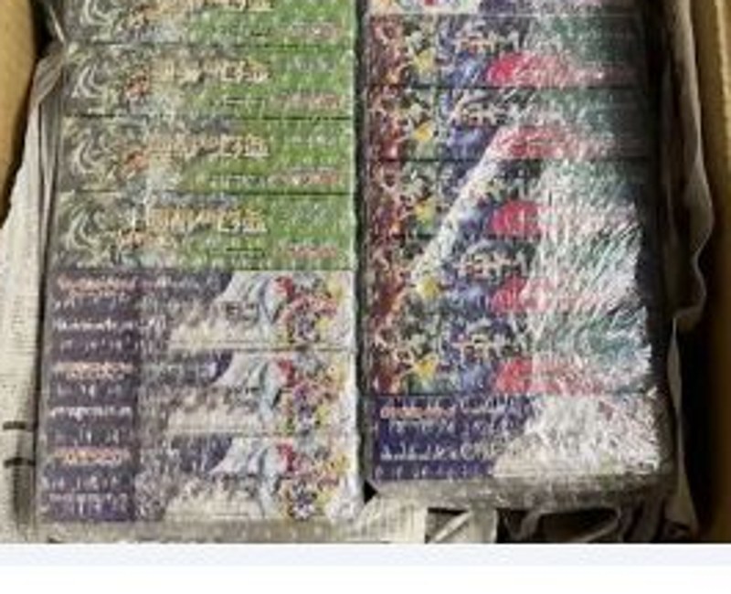 Packed Japanese TCG sealed products arranged inside a shipping carton