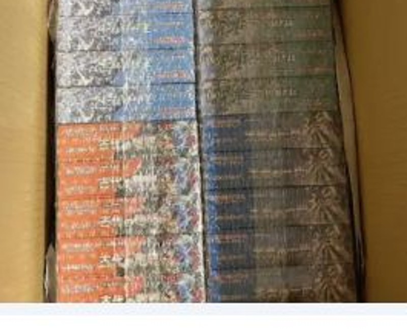 Sealed Japanese trading card products being prepared for packing