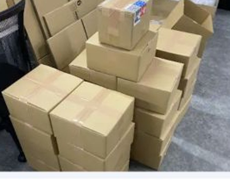 Outgoing shipment cartons prepared for international dispatch